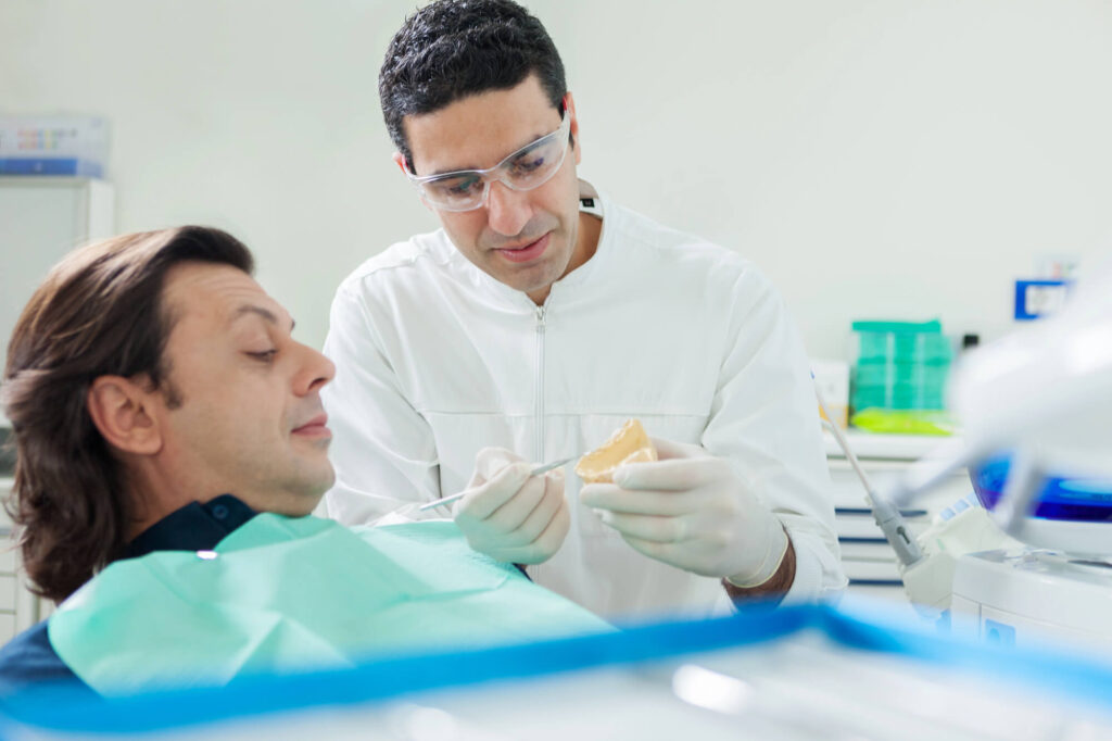 Dentist showing Dental implants Mamaroneck NY