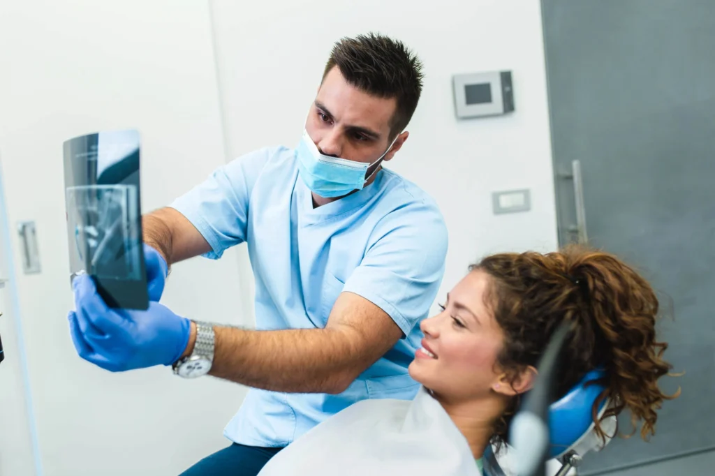 Girl checking her Xray with her Dentist in Harrison NY