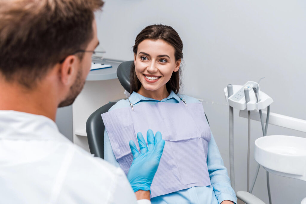 Woman smiling after root canal treatment by a Gentle dentist Harrison NY