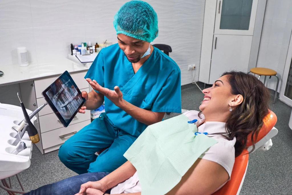 Girl looking at her xray showed by a Cosmetic dentist Harrison NY