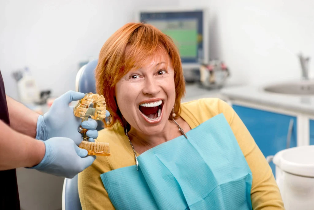 Woman smiling with her Dental implants Harrison NY